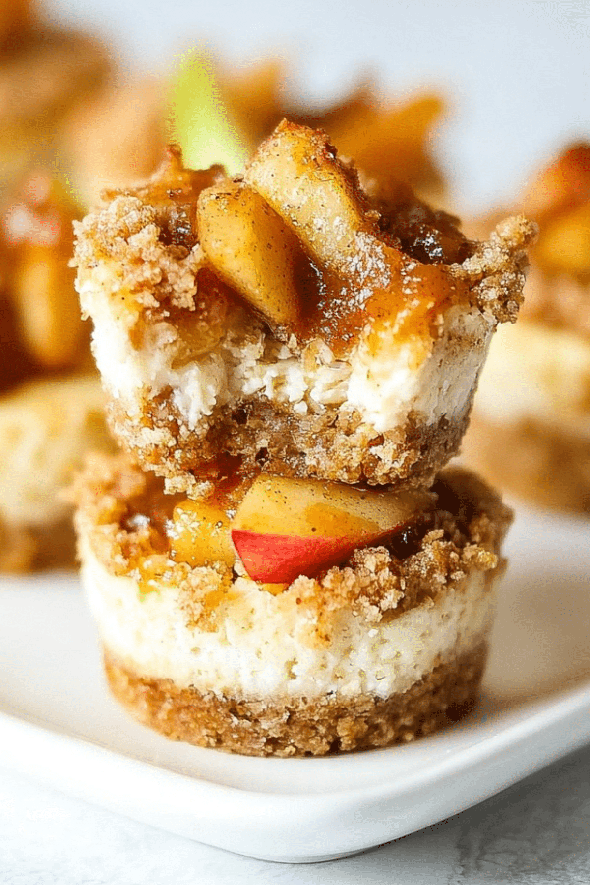 Apple Pie Cheesecake Bites with cinnamon apples on top