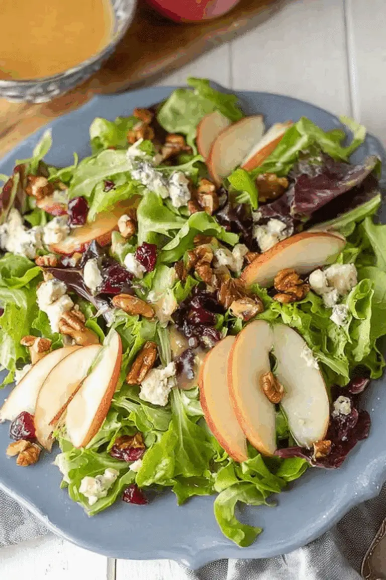 Fall Salad with Maple Vinaigrette featuring apples, blue cheese, and cranberries