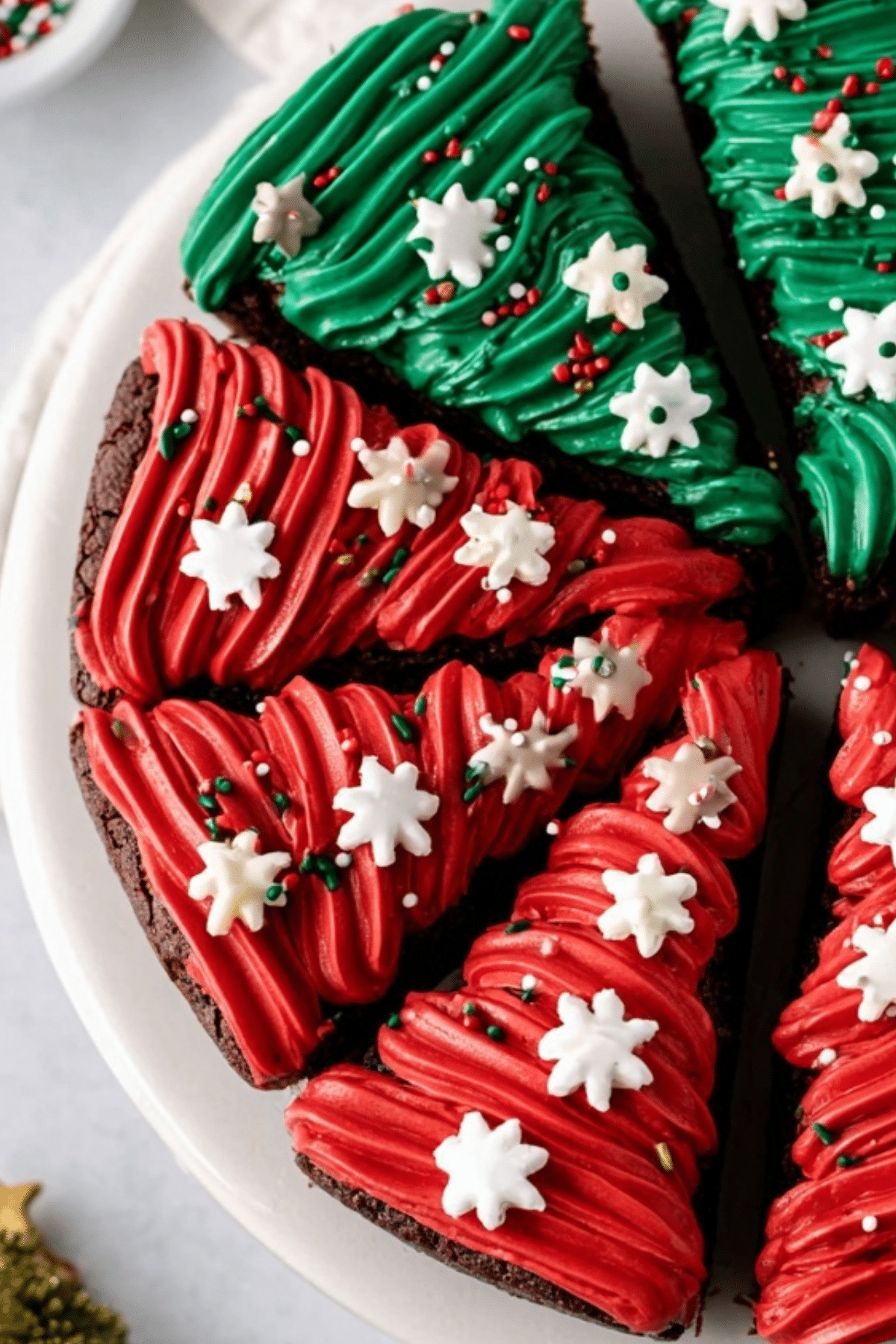 Frosted Christmas Brownies with red and green decorations for the holidays