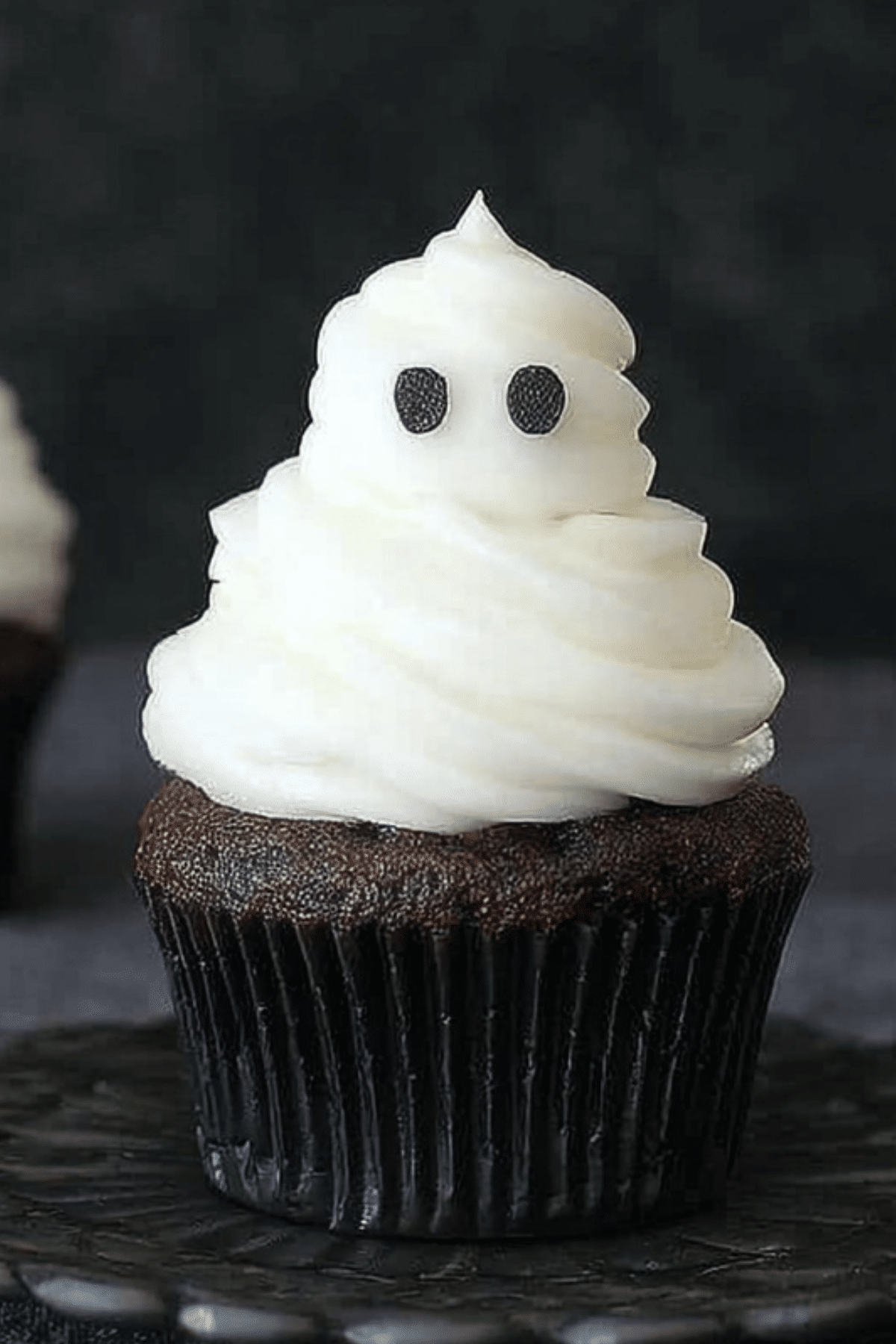 Ghost Cupcakes decorated with vanilla buttercream frosting for Halloween