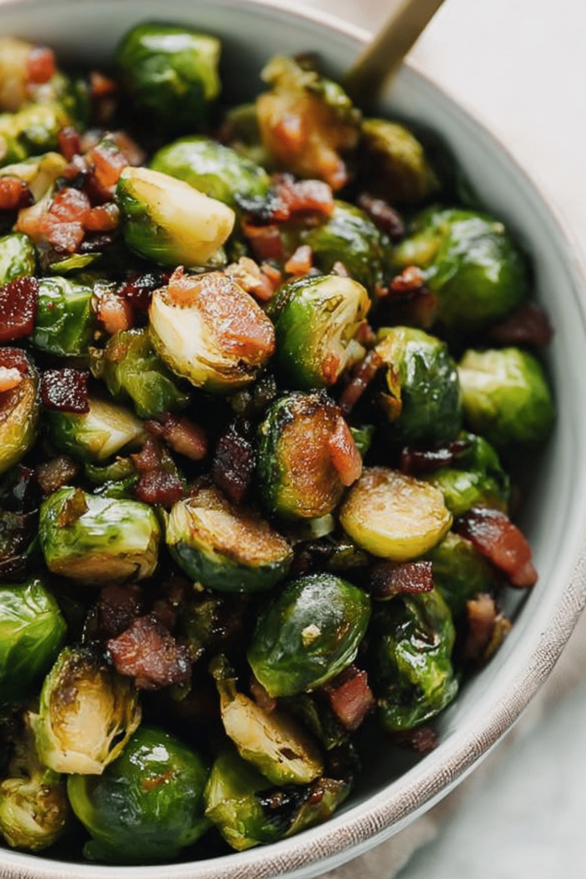 Maple Bacon Brussels Sprouts on a plate with crispy bacon and pecans