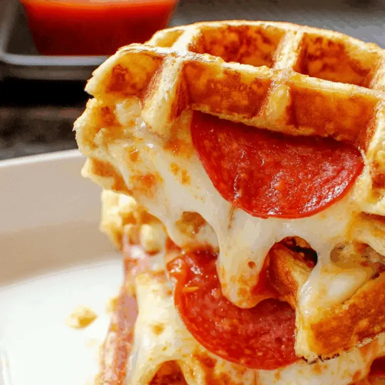 Stuffed Pepperoni Pizza Waffles cooked in waffle iron with melted cheese