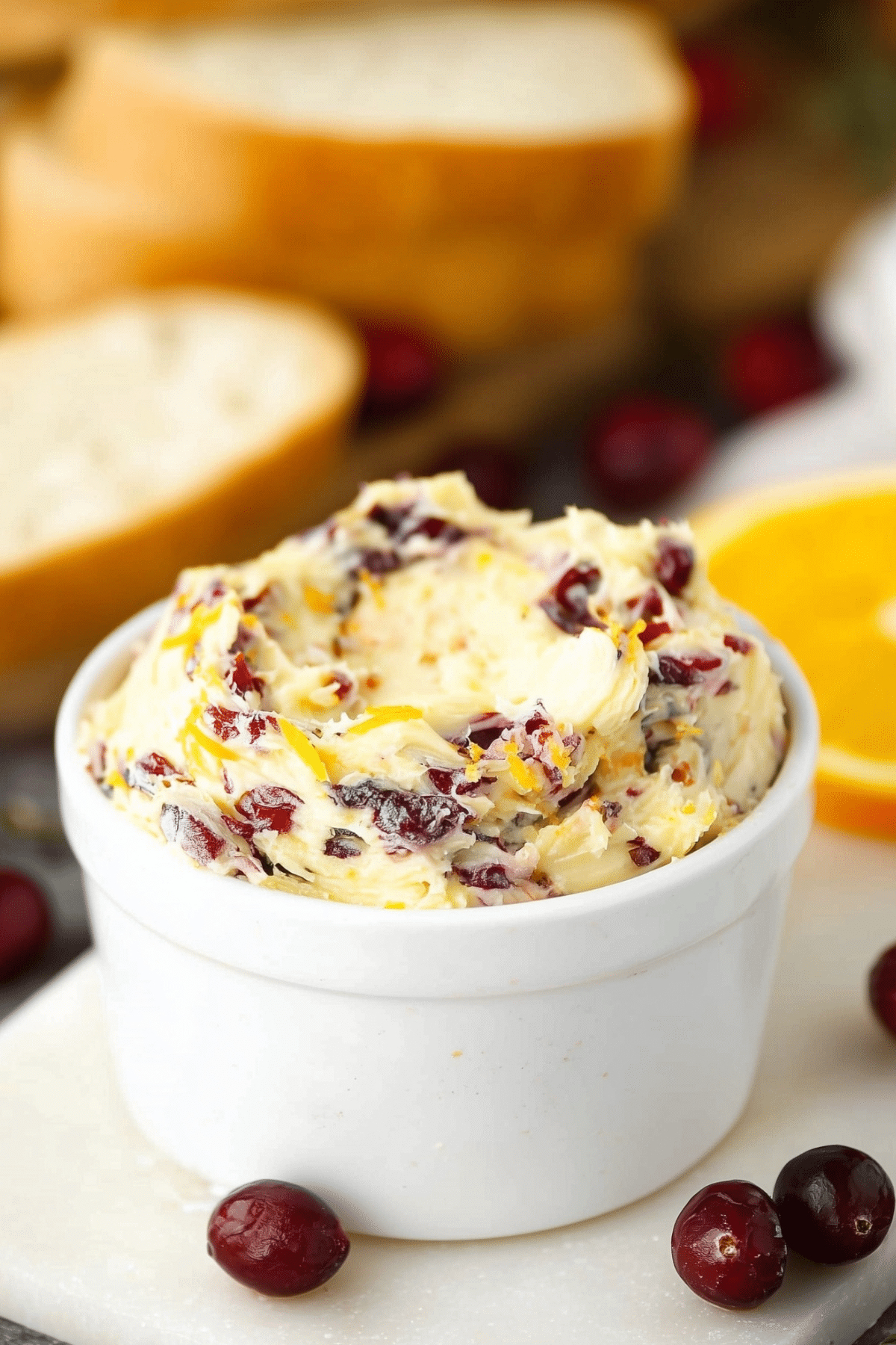 Creamy cranberry honey butter spread with dried cranberries and orange zest