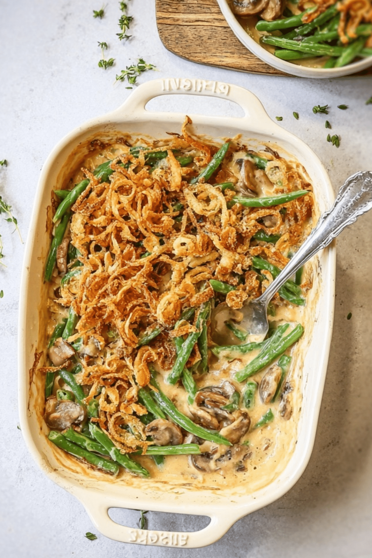 Fresh Green Bean Casserole in baking dish with crispy onion topping