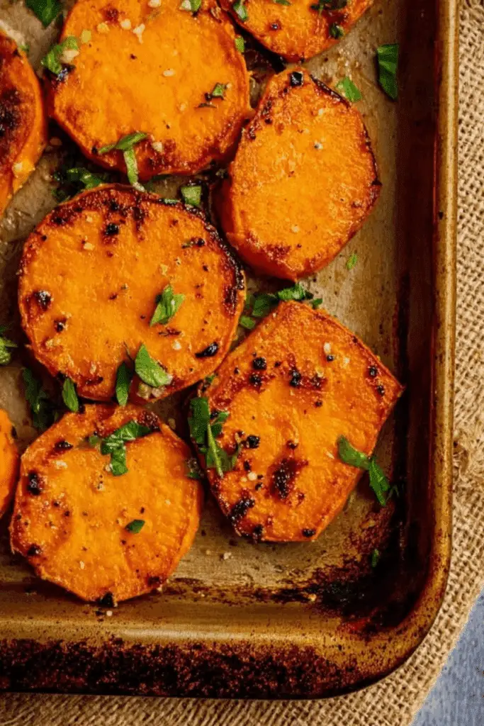 Garlic Butter Roasted Sweet Potatoes on a baking sheet