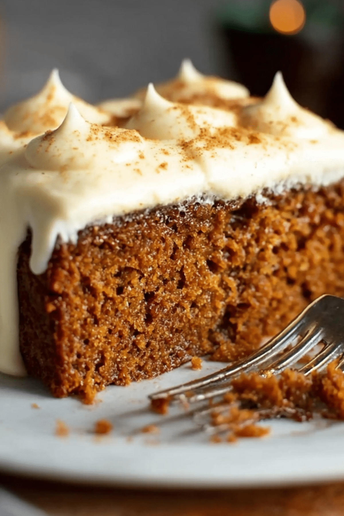 Gingerbread Cake with Luscious Cream Cheese Frosting on a holiday plate