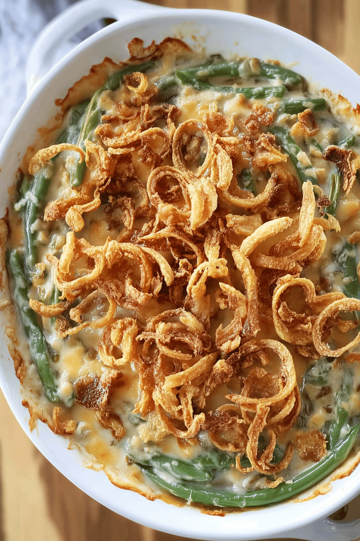 Homemade Green Bean Casserole with crispy fried onions and creamy sauce