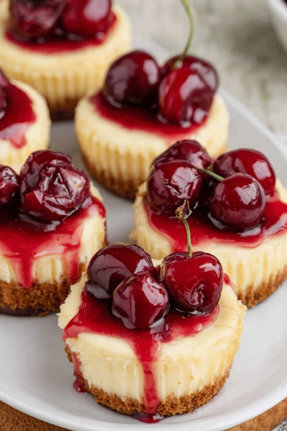 mini cherry cheesecakes recipe with creamy filling and cherry topping