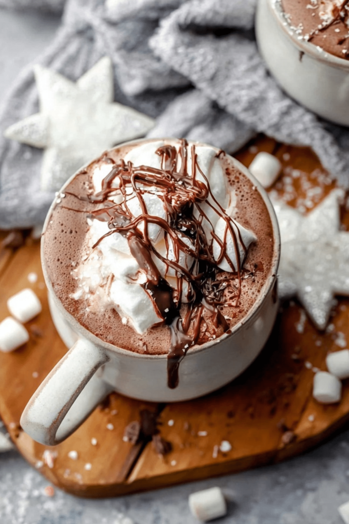 Peppermint Hot Chocolate in a mug with whipped cream and candy cane