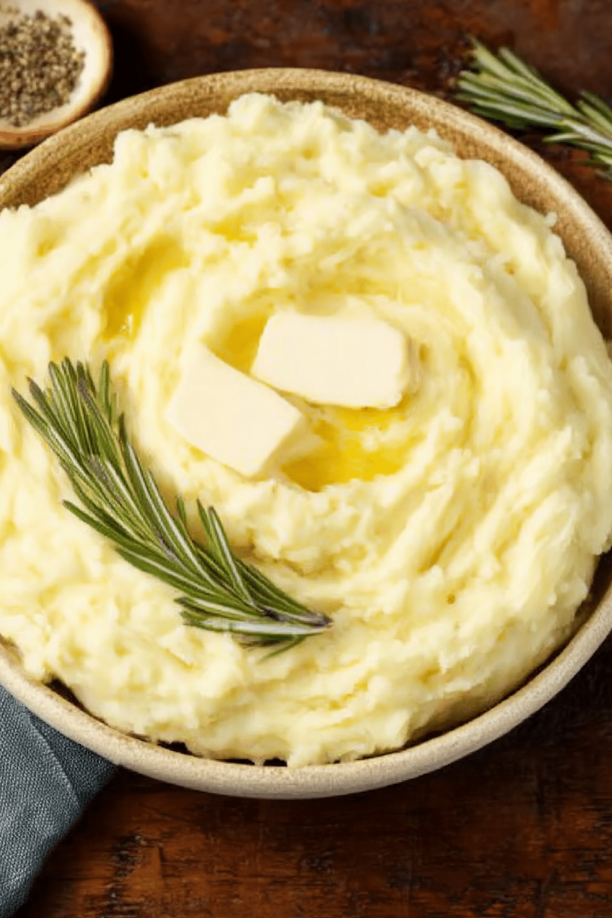Creamy rosemary garlic mashed potatoes served in a white bowl