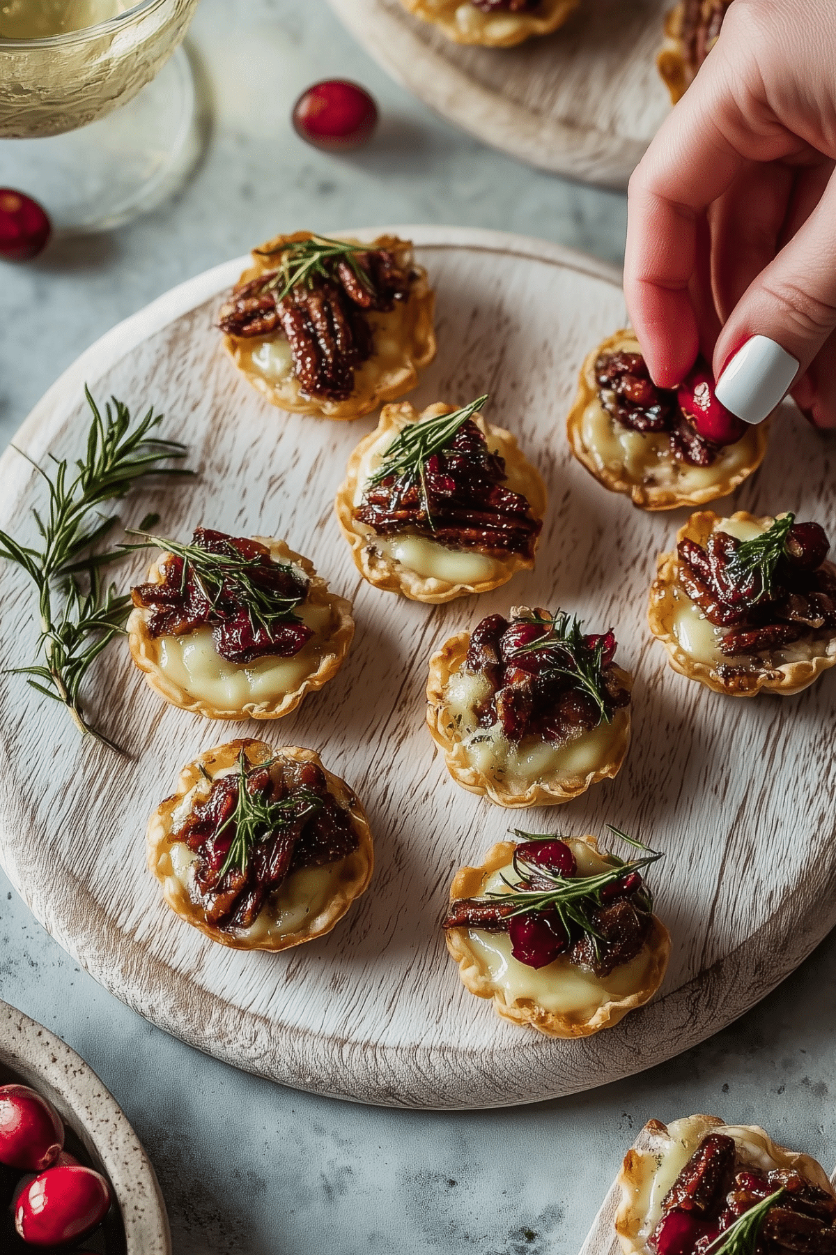 Cranberry Brie Tartlets on a serving tray, perfect for the holiday season.