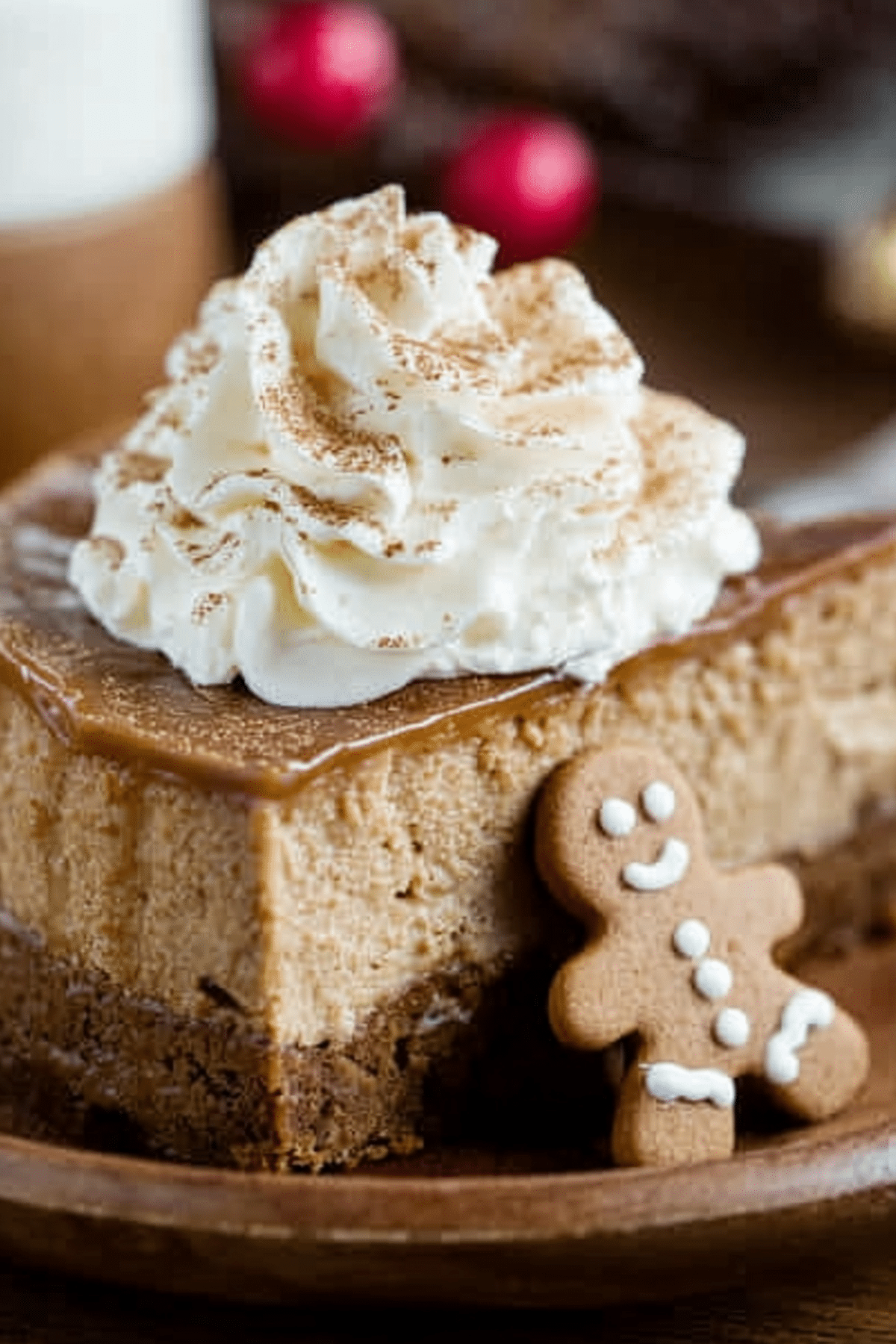 Gingerbread Cheesecake topped with whipped cream and cinnamon