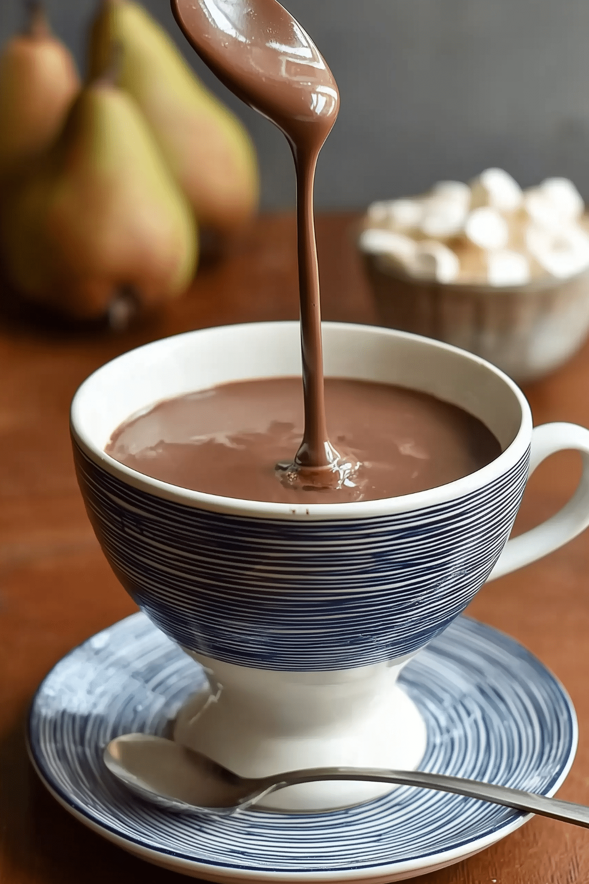 Parisian Hot Chocolate served in a cup with whipped cream and a sprinkle of sea salt