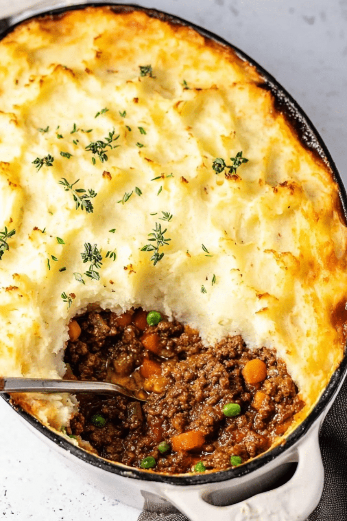 Shepherd's Pie topped with golden mashed potatoes in a casserole dish
