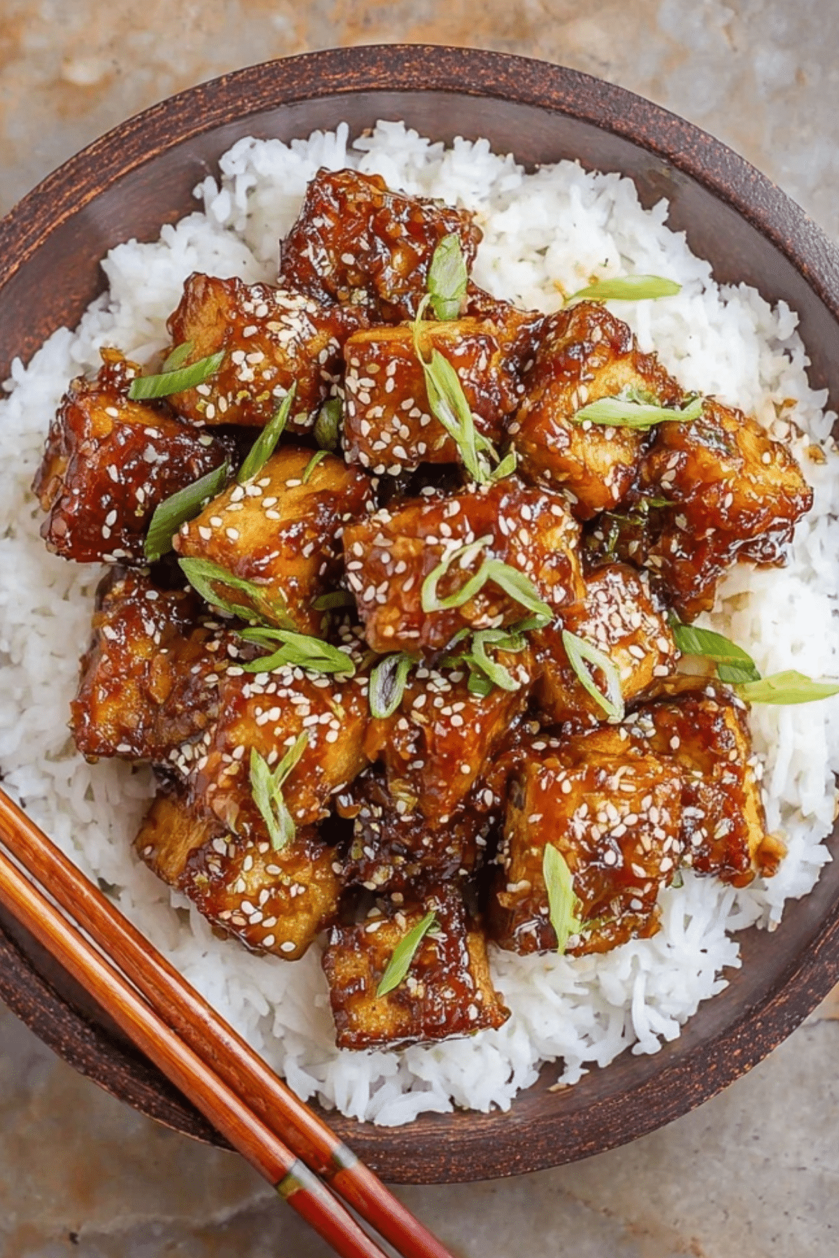 Sticky Sesame Tofu served with rice and sesame seeds