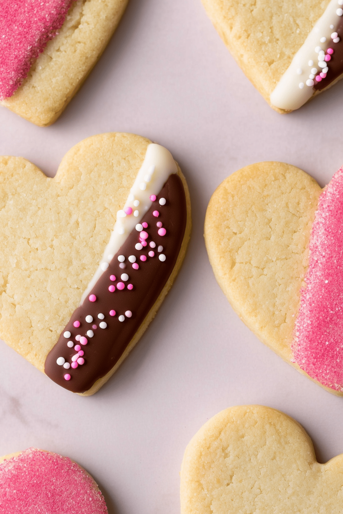 Valentine’s Shortbread Hearts dipped in chocolate and decorated with sprinkles