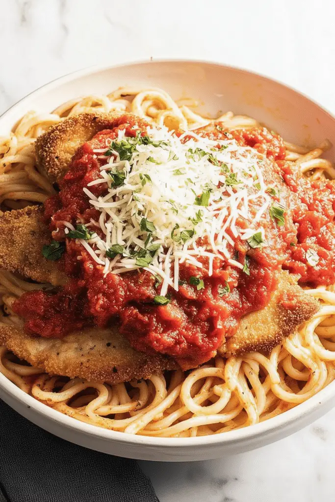 Delicious Veal Parmesan served with pasta