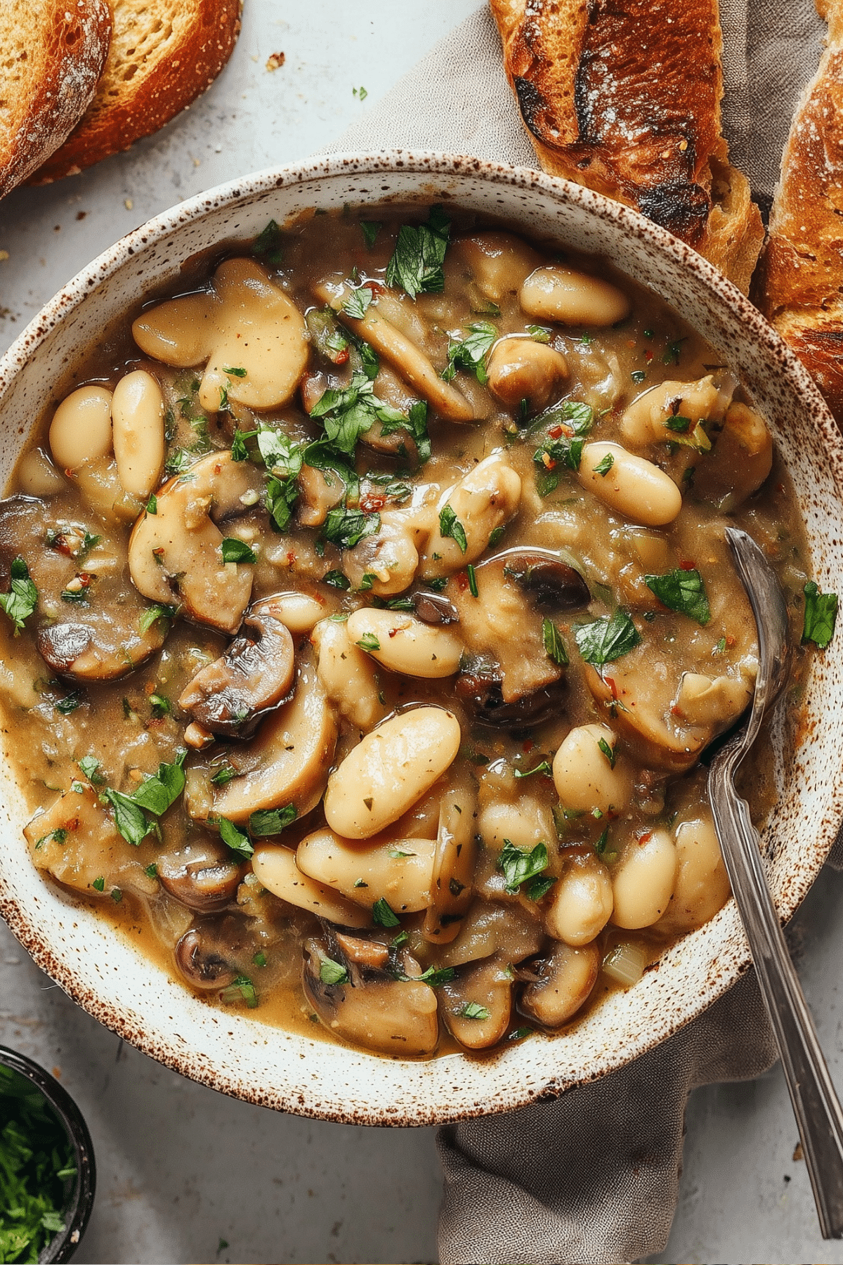 Vegan White Bean Mushroom Stew served in a bowl
