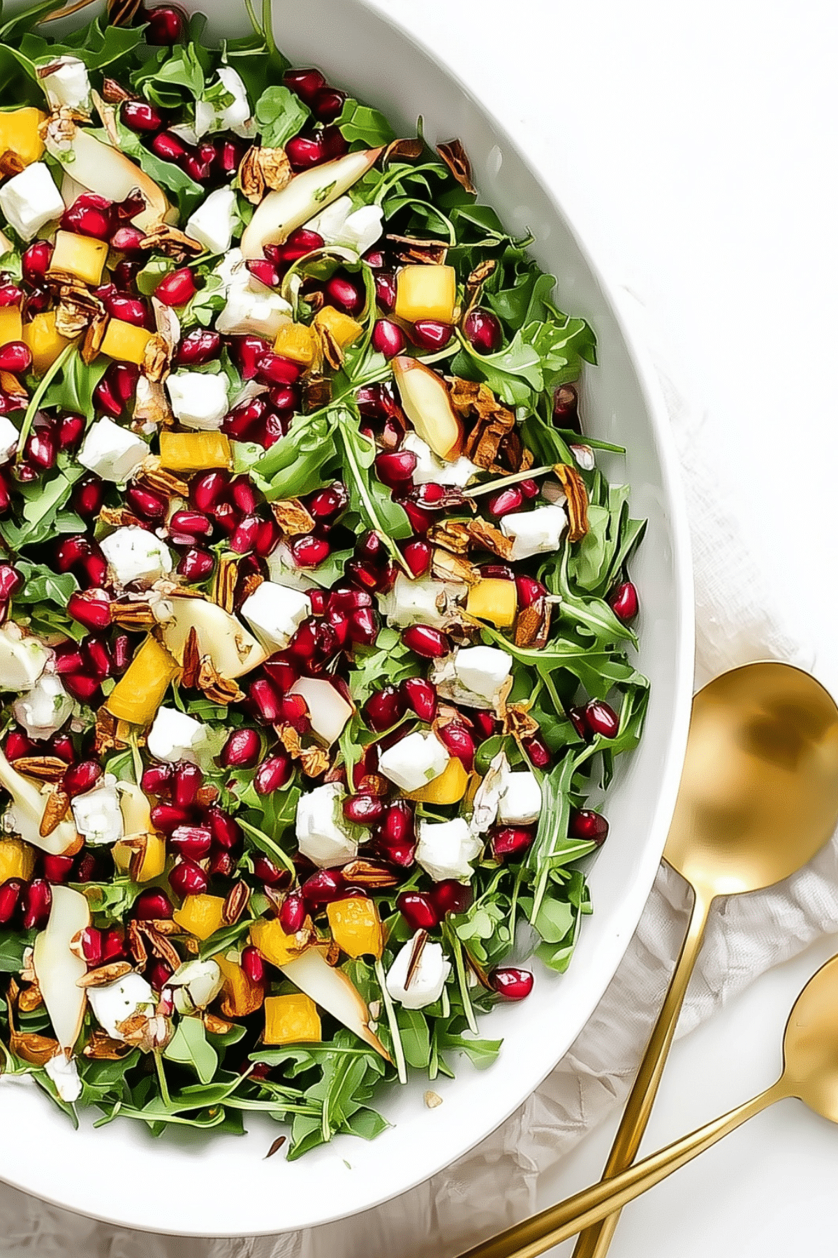 Winter Holiday Salad with pear, pomegranate, and goat cheese