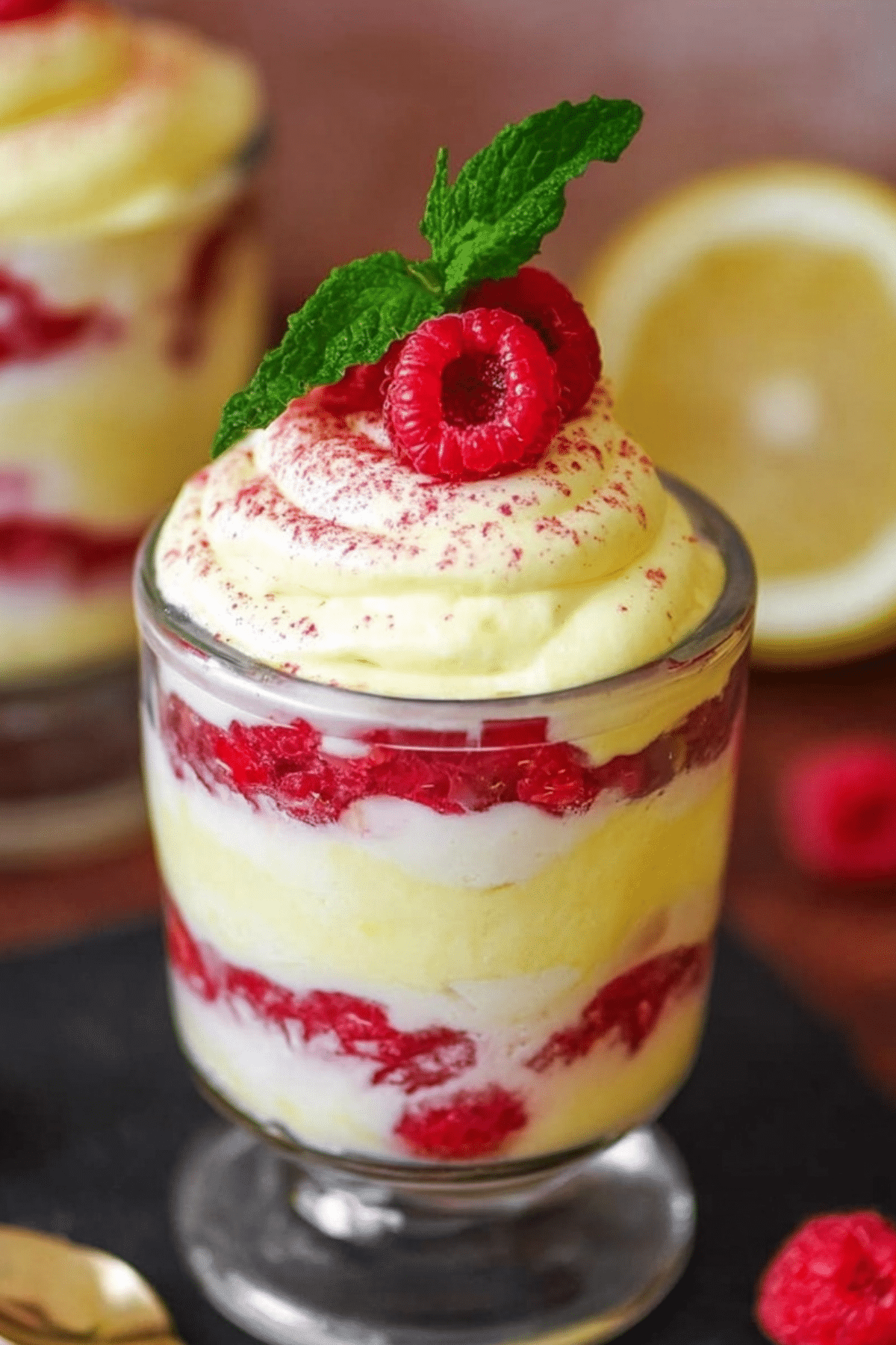 Lemon Raspberry Fluff dessert with whipped cream and fresh raspberries