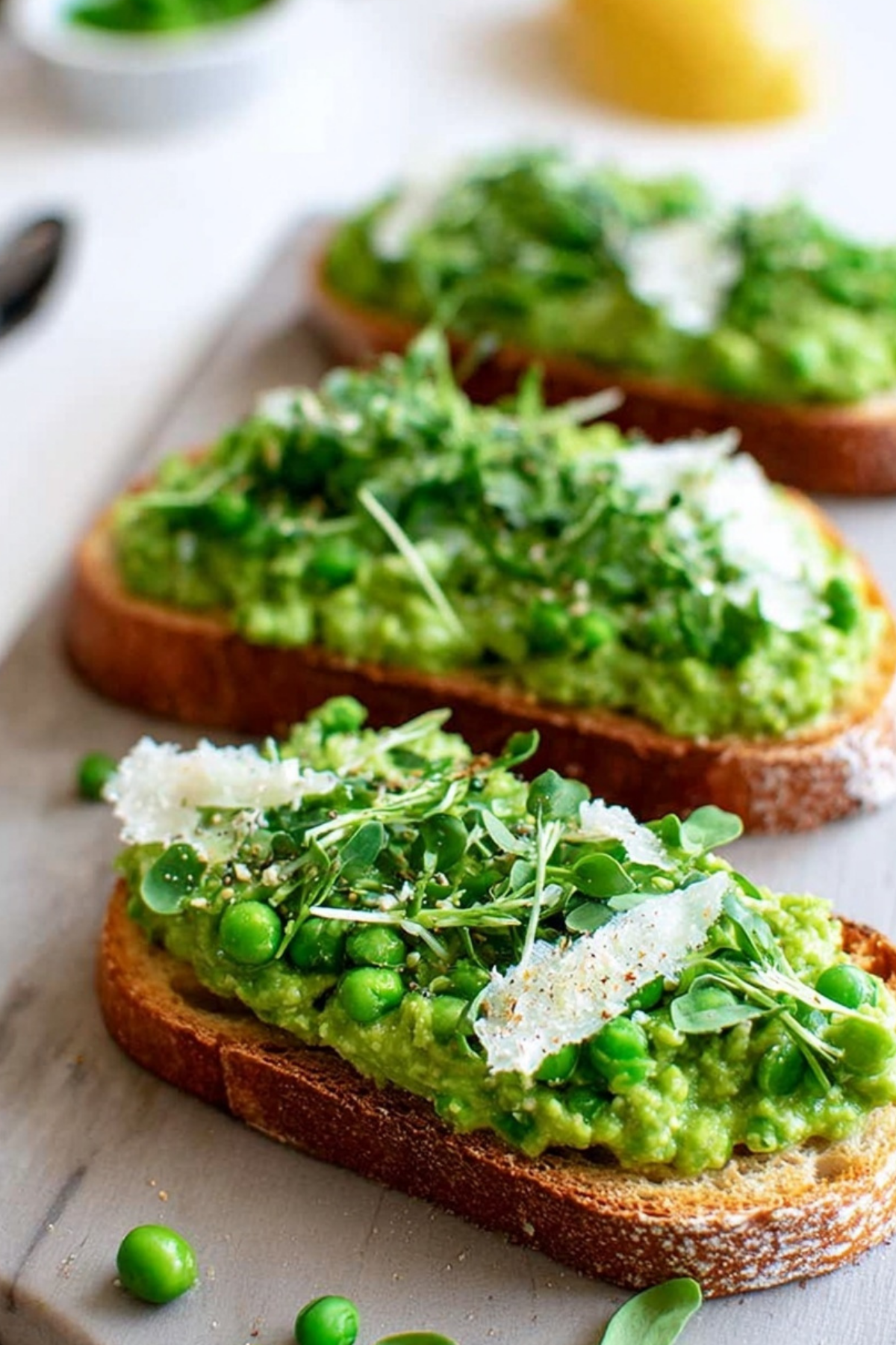 Pea Bruschetta with pea pesto, parmesan, and lemon zest