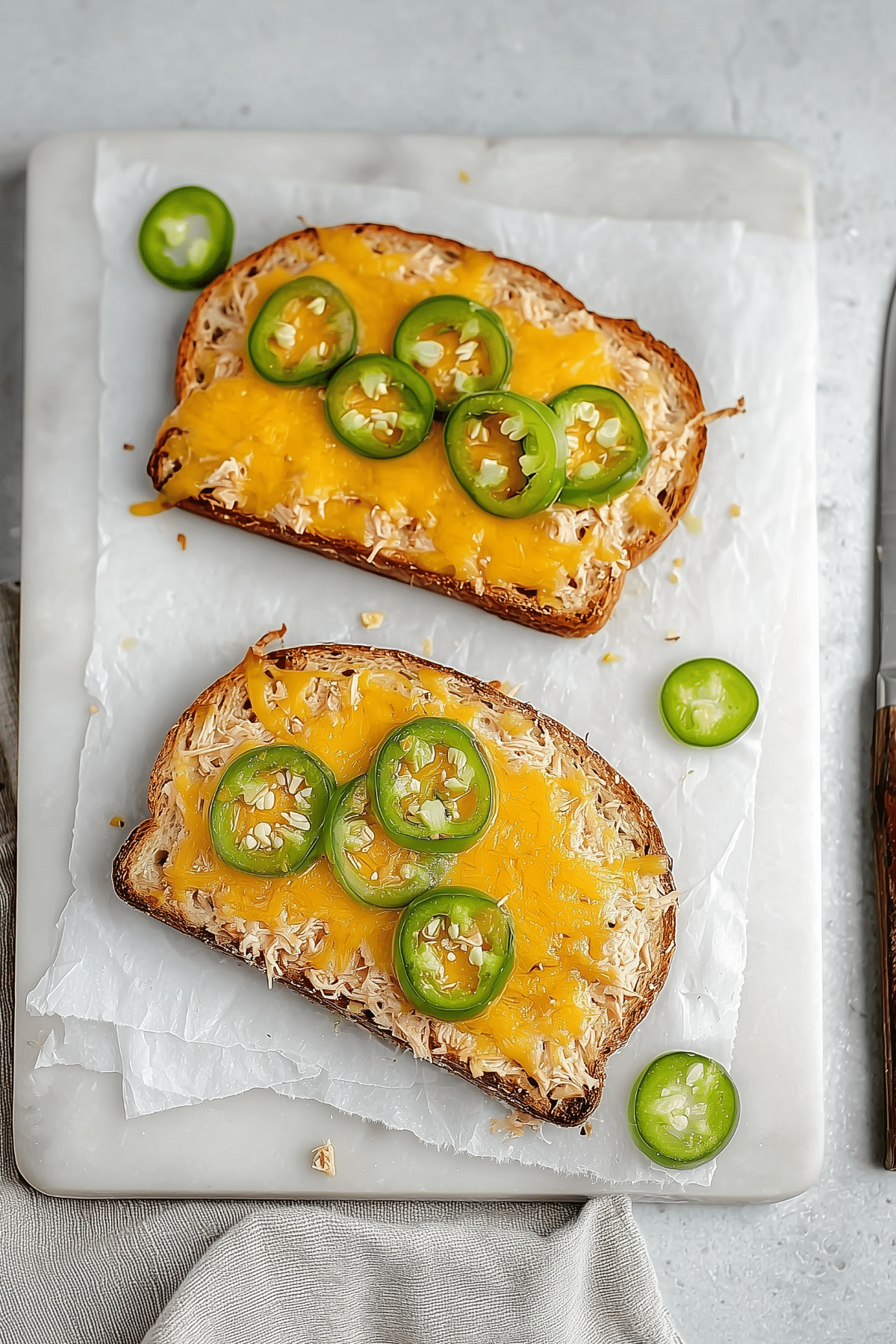 Spicy Jalapeño Cheddar Tuna Melt sandwich with melted cheese