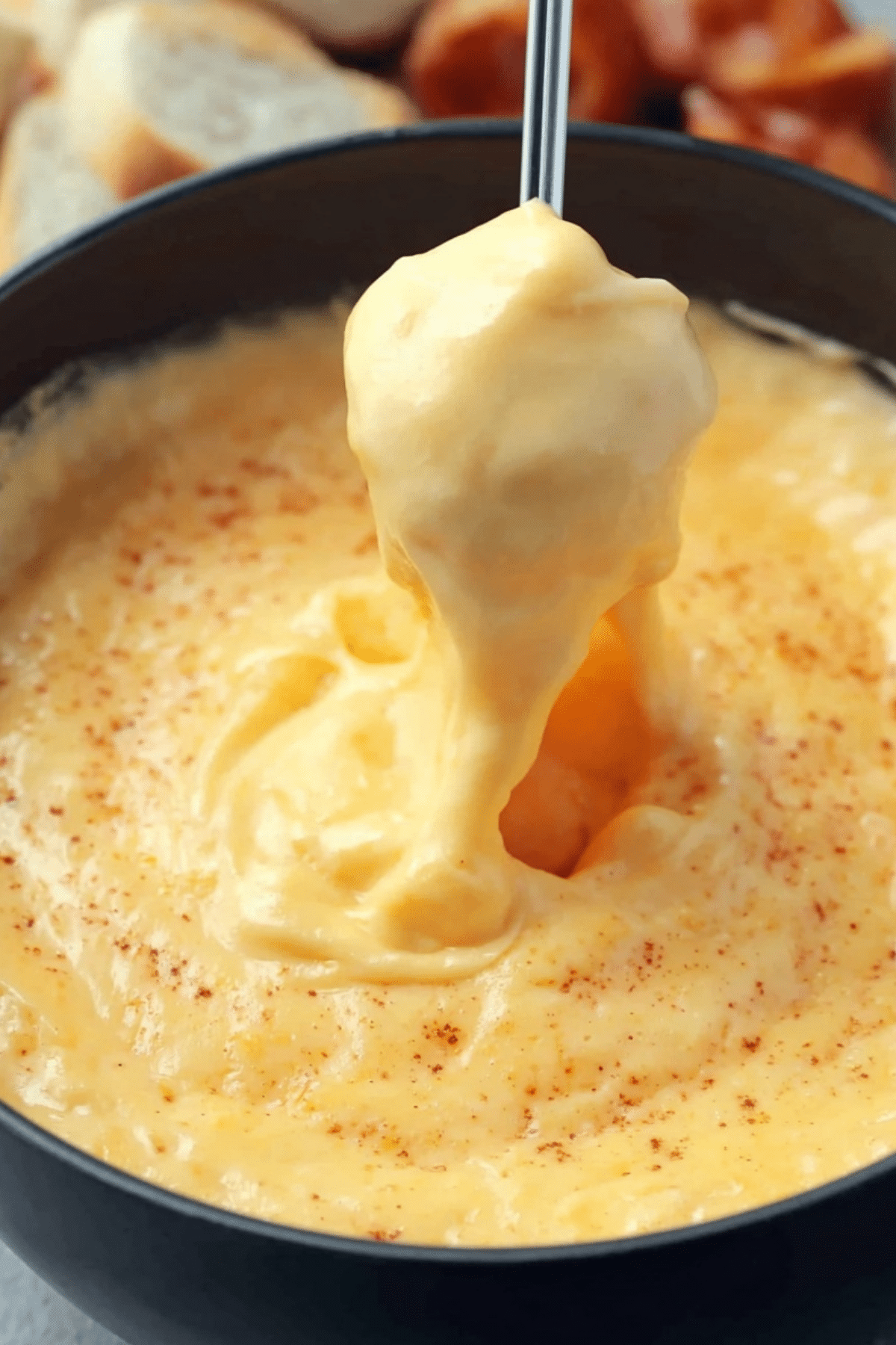 Creamy homemade Beer Cheese Dip served with soft pretzels