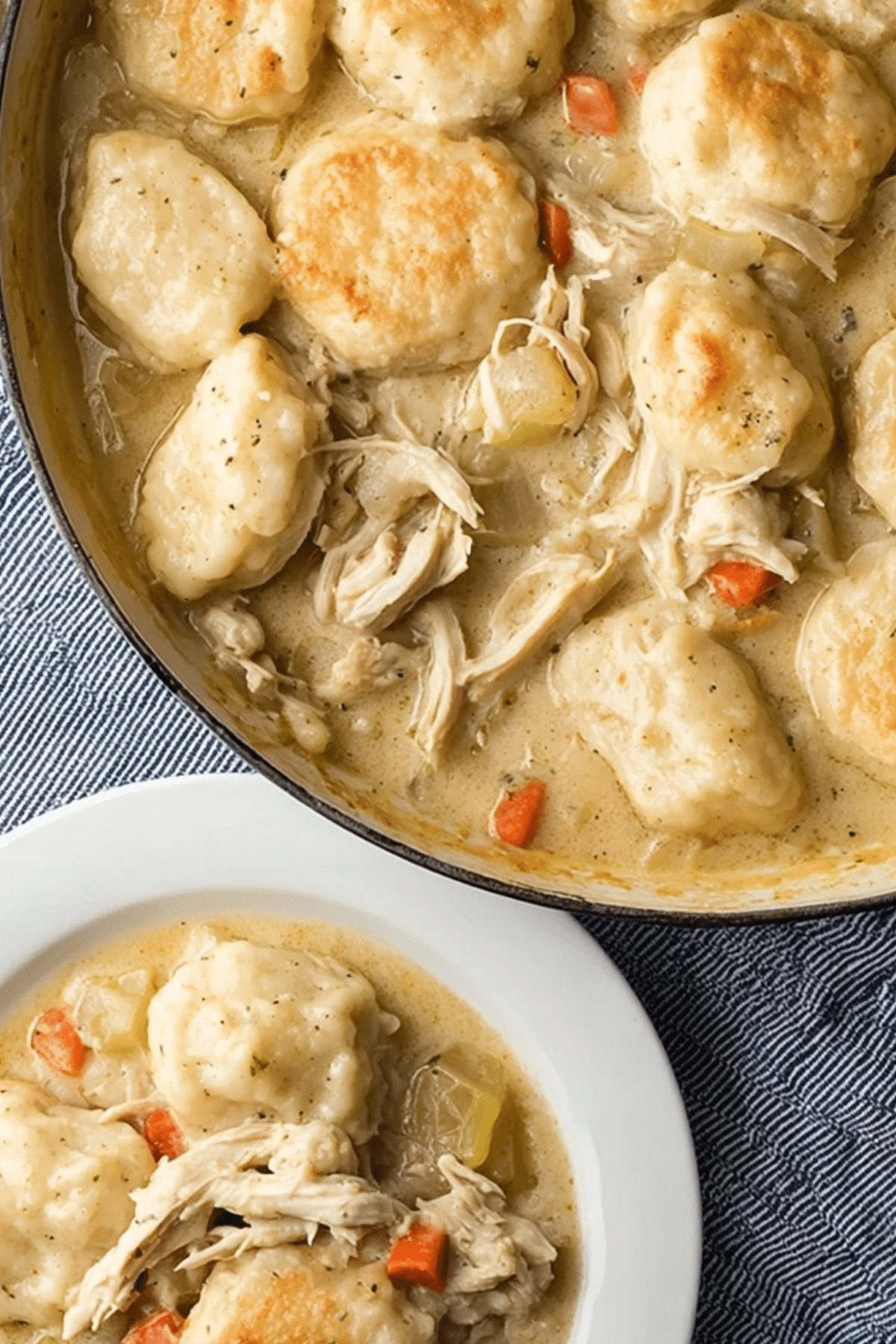 Chicken and Dumplings with Biscuits served in a bowl with creamy broth