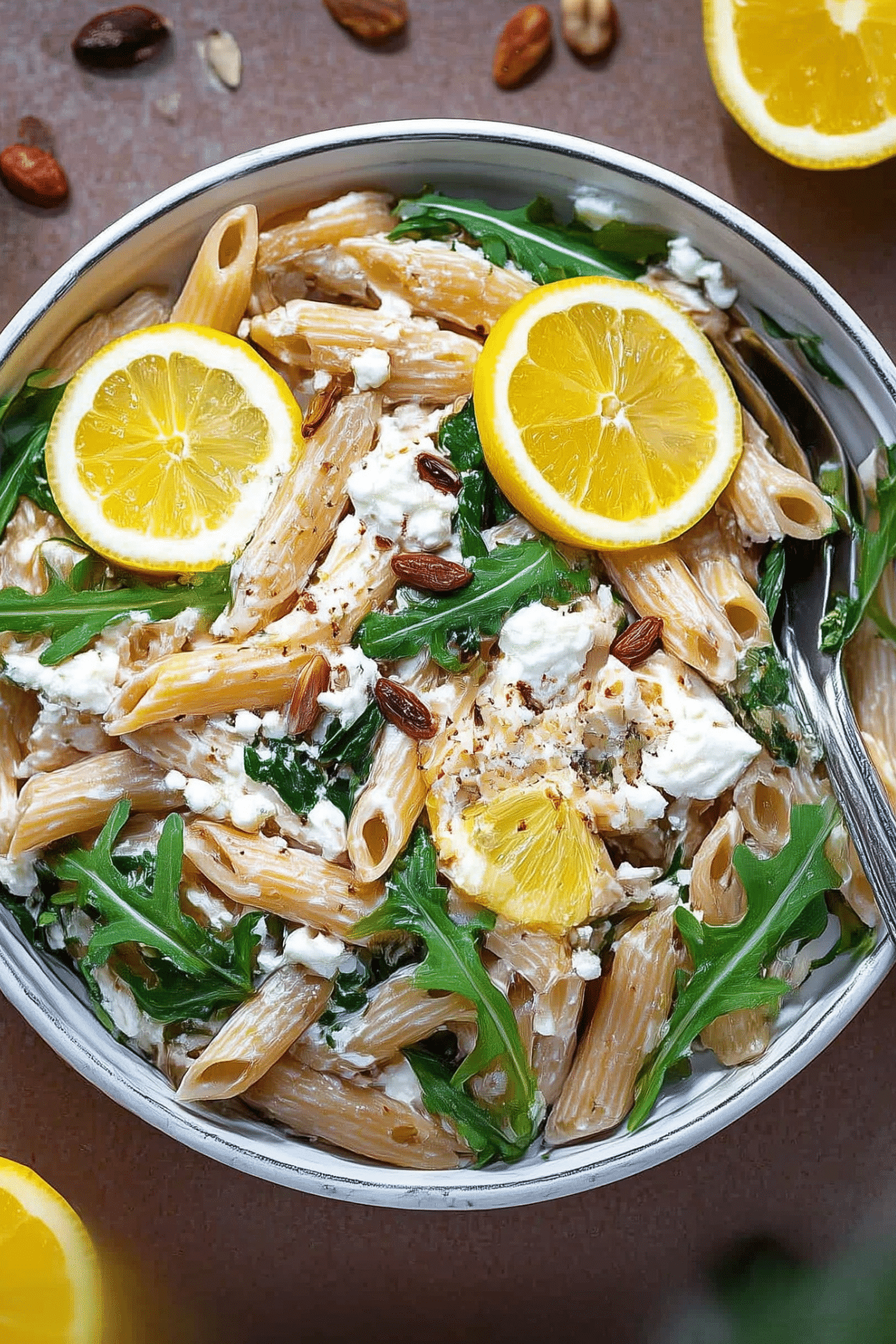 One Pot Lemon Ricotta Pasta with Arugula served in a bowl with fresh lemon zest and arugula