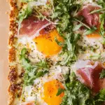 Baked Prosciutto and Egg Breakfast Tart with flaky crust and eggs