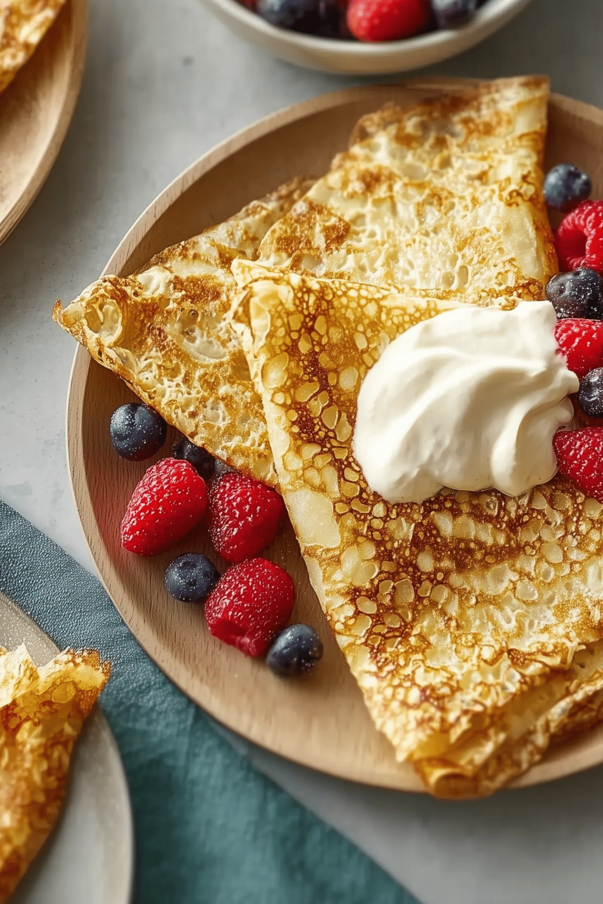 Basic crêpes recipe on a plate with toppings