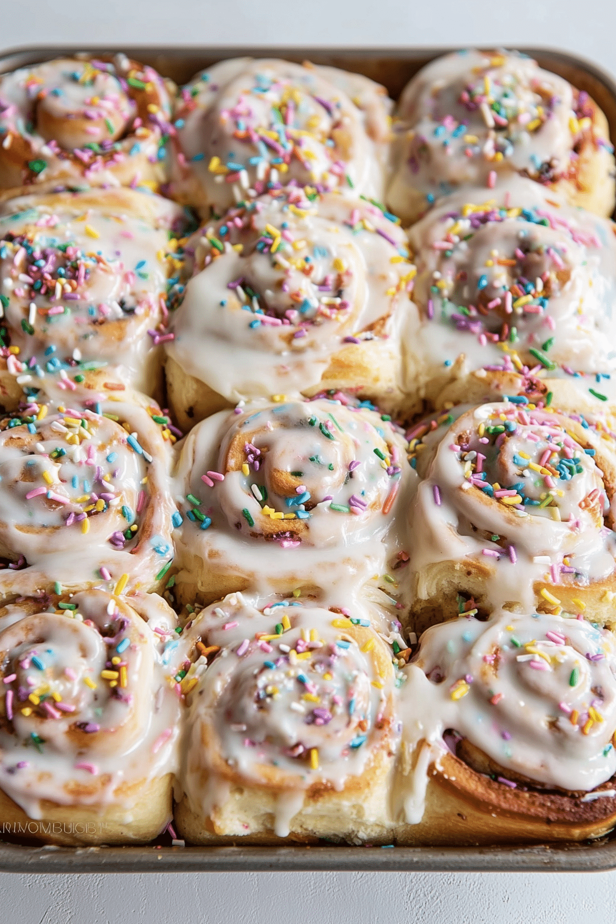 Funfetti Cinnamon Rolls with cream cheese frosting and rainbow sprinkles