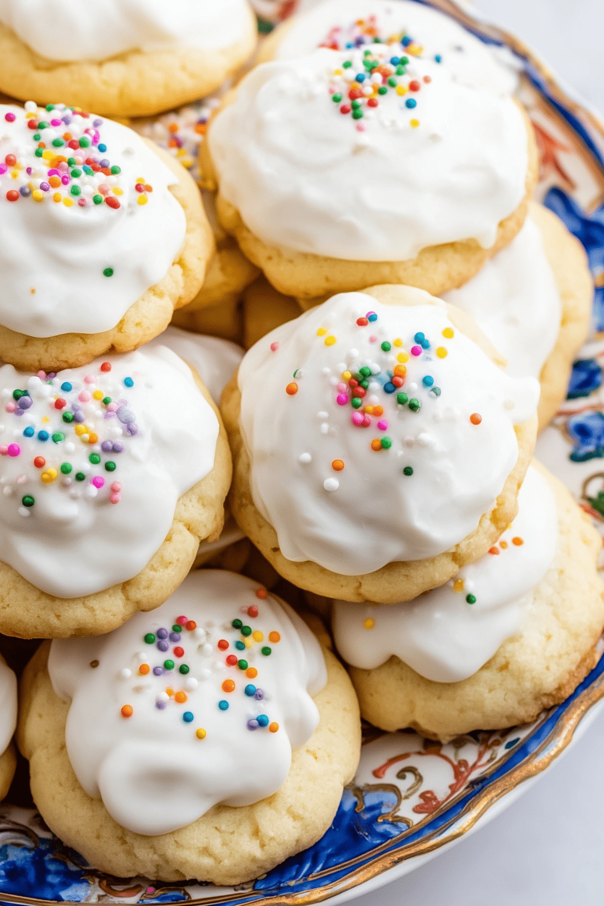 Soft glazed ricotta cookies on a plate
