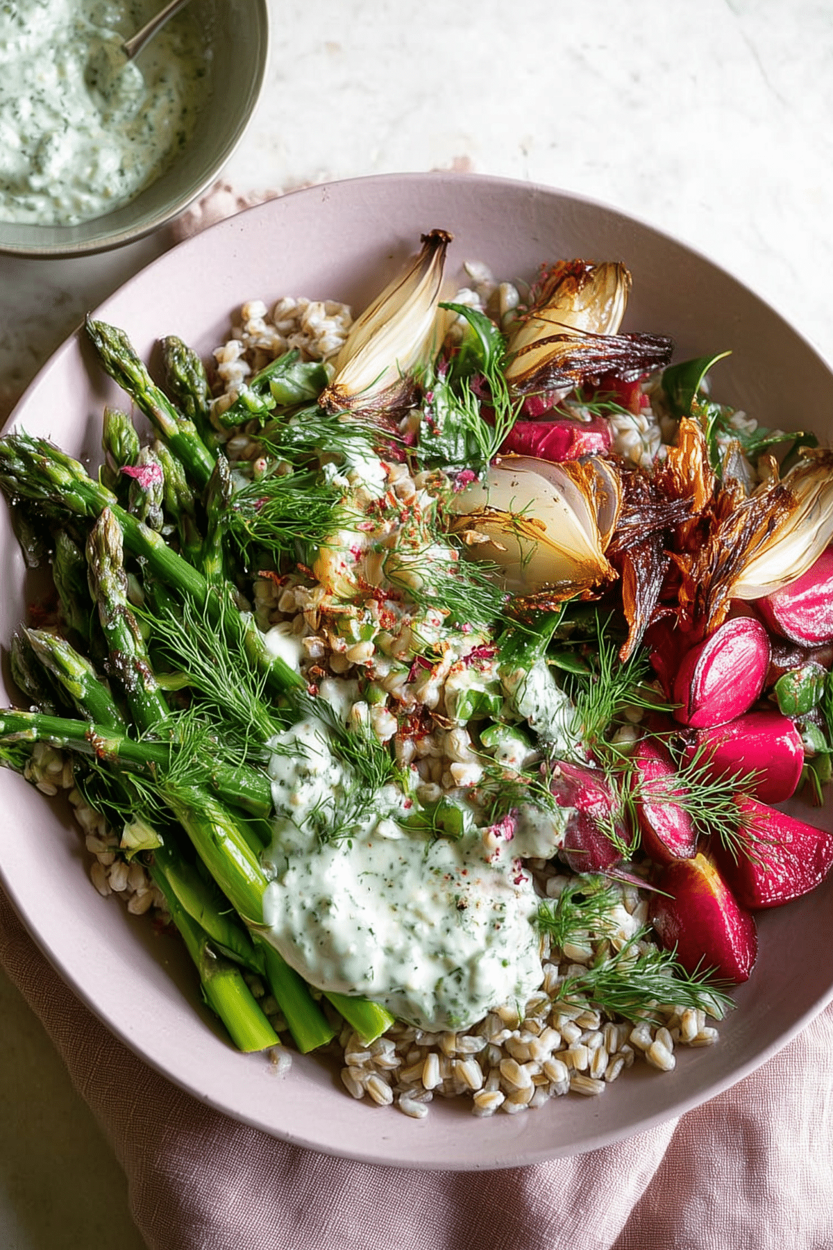 Spring Farro Bowl with Herb Yogurt Sauce, a healthy and fresh dish with seasonal vegetables