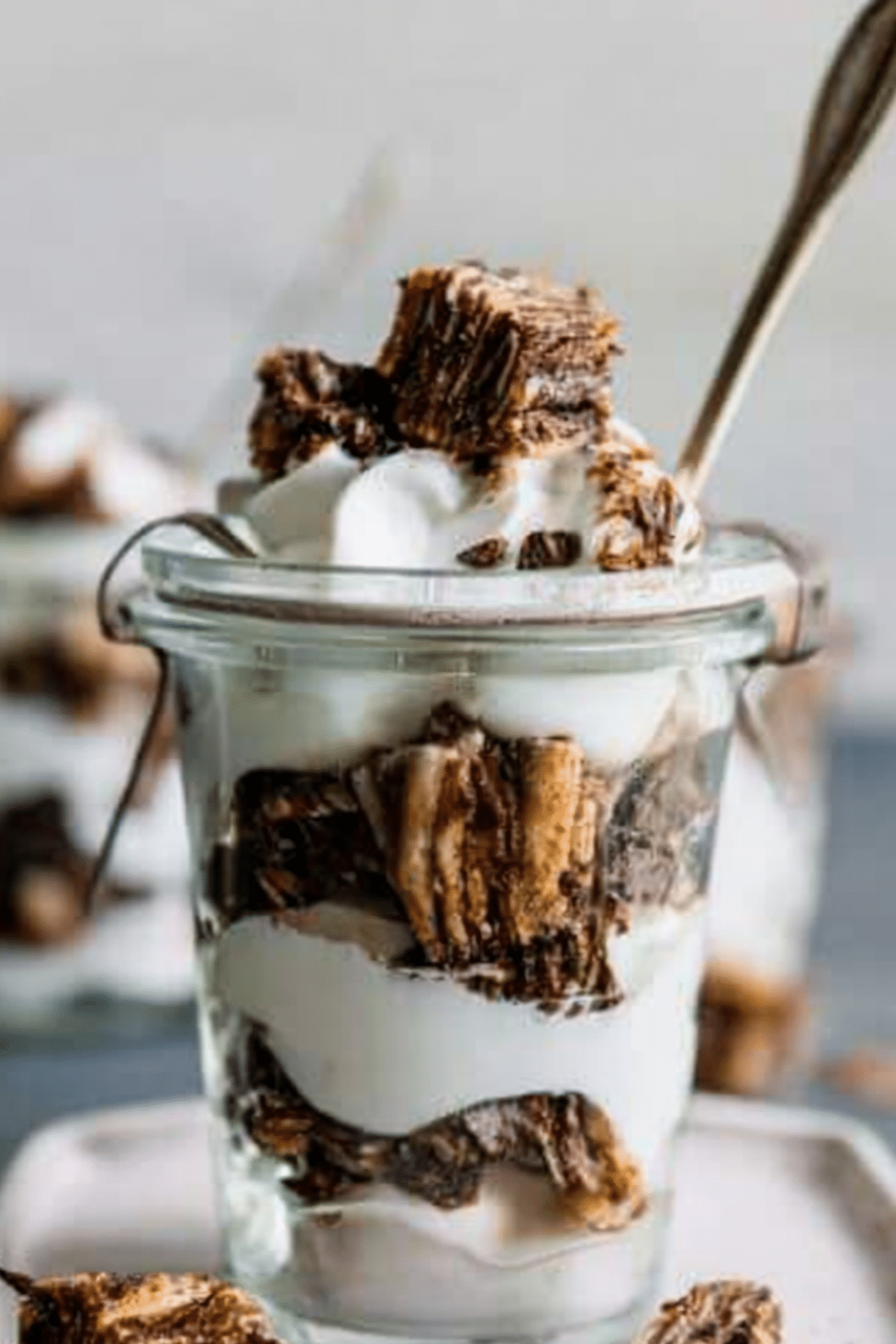 Chocolate Babka Parfaits layered with whipped cream and chocolate shavings