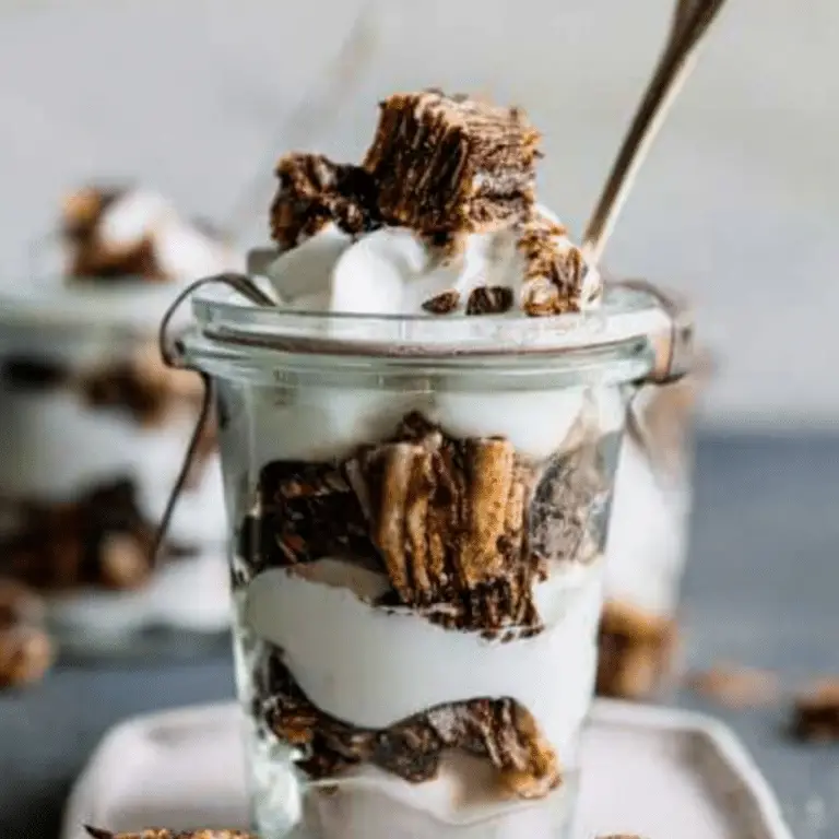 Chocolate Babka Parfaits layered with whipped cream and chocolate shavings