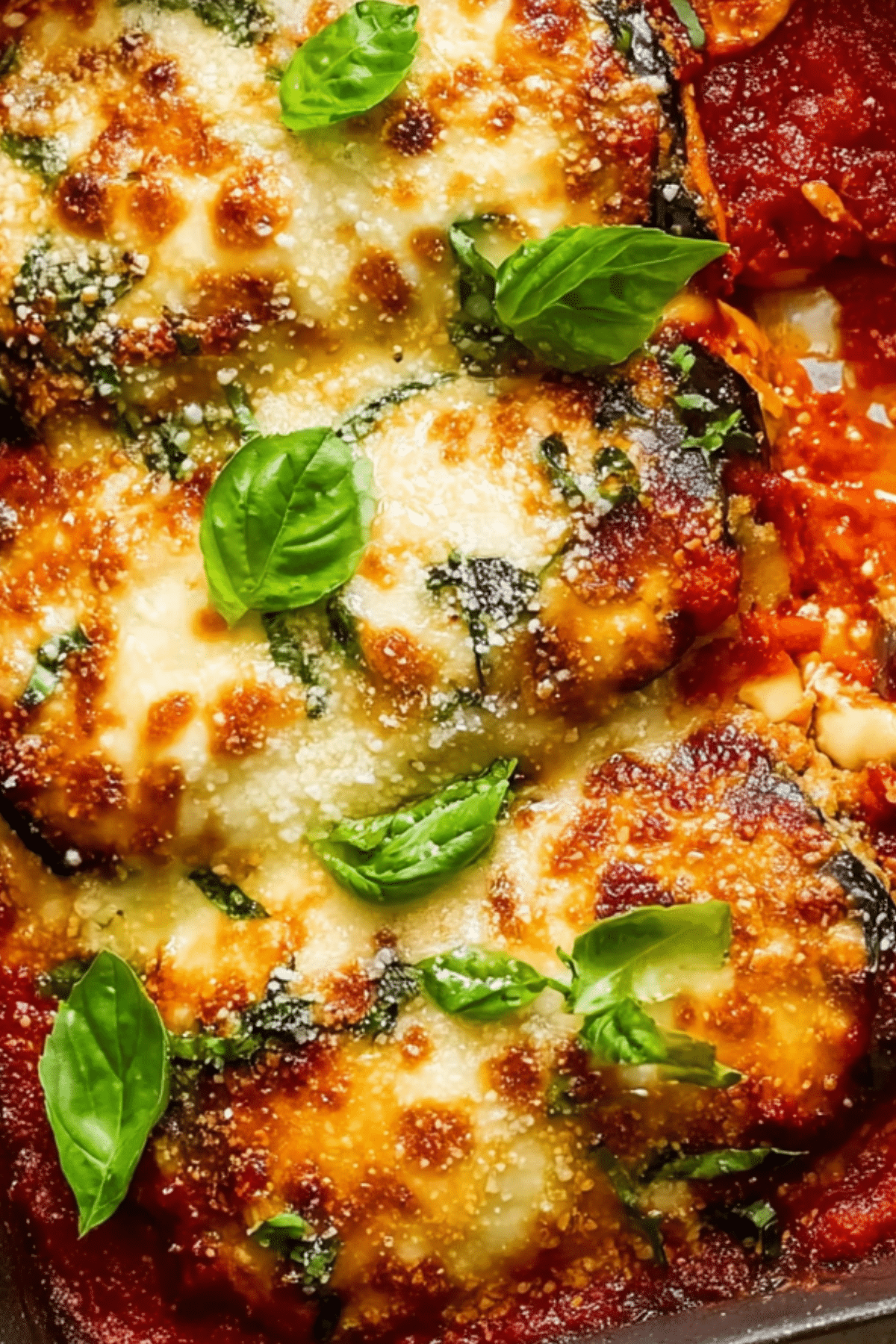 Eggplant Parmigiana with baked layers, tomato sauce, and melted cheese