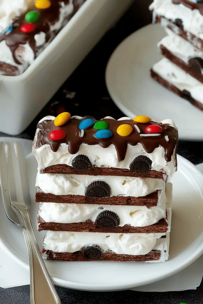 Ice Cream Sandwich Cake layered with whipped topping and candy