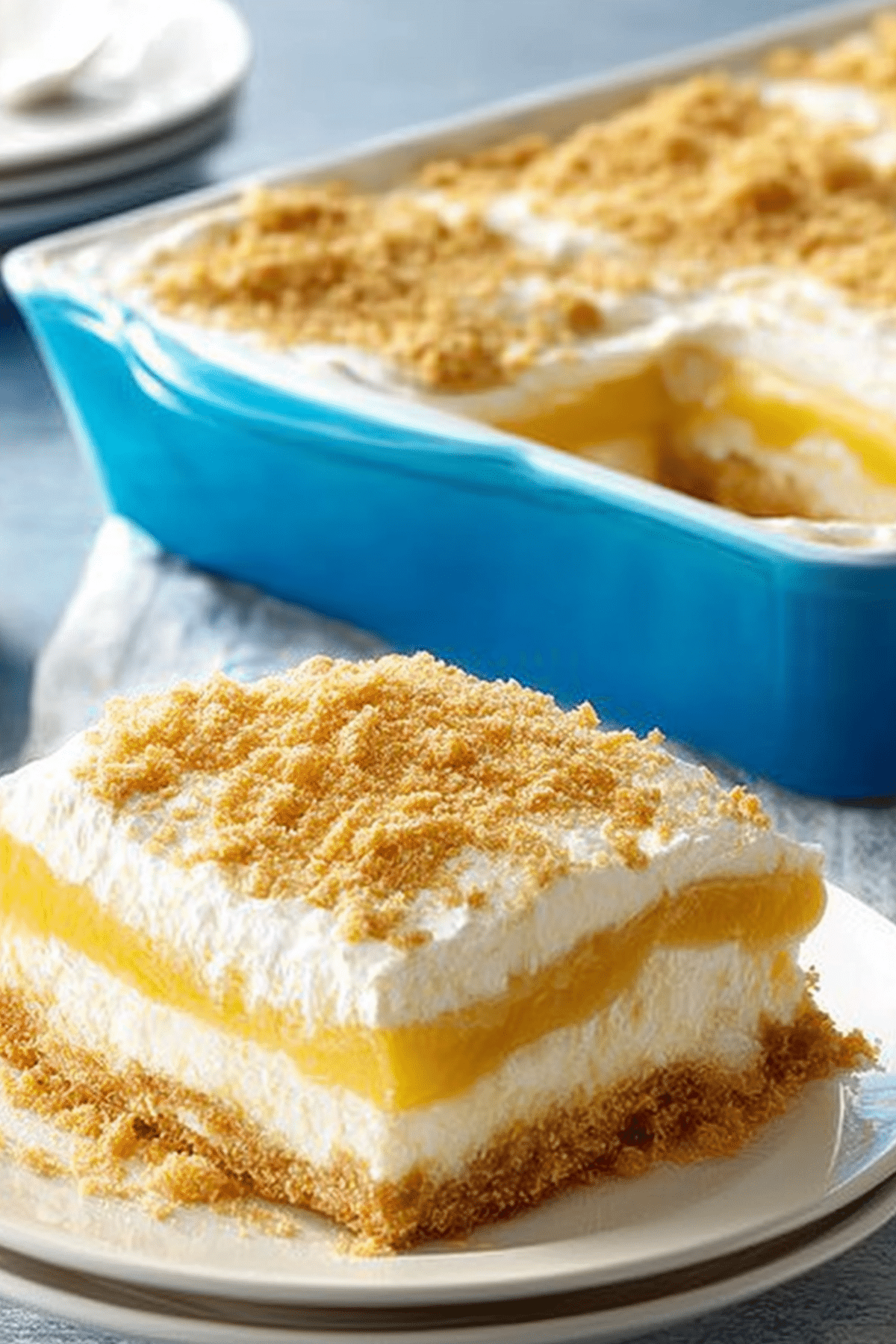 Layered Lemon Dessert Squares with creamy layers and lemon topping