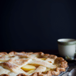 Homemade nectarine pie with golden flaky crust and juicy filling