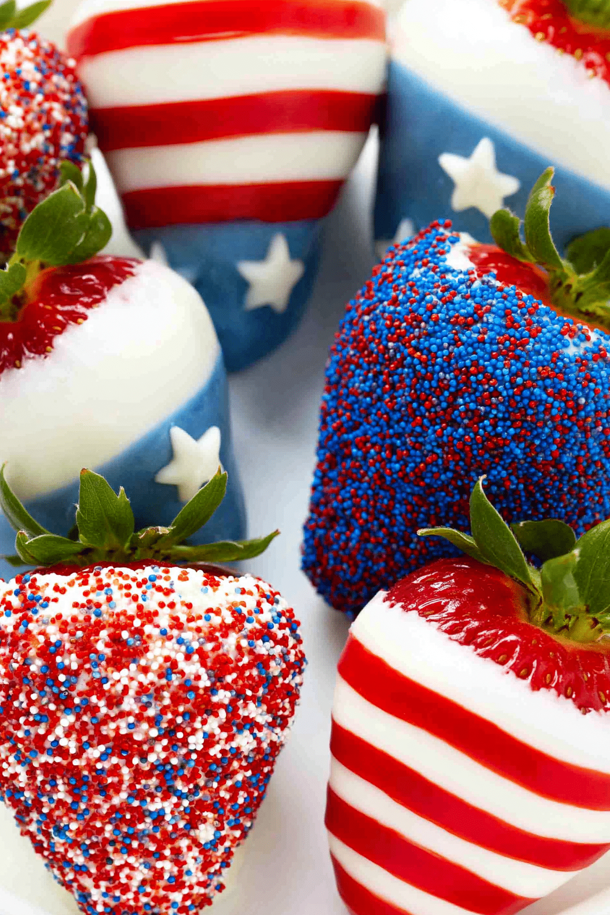 Patriotic Chocolate Covered Strawberries decorated with red white and blue sprinkles