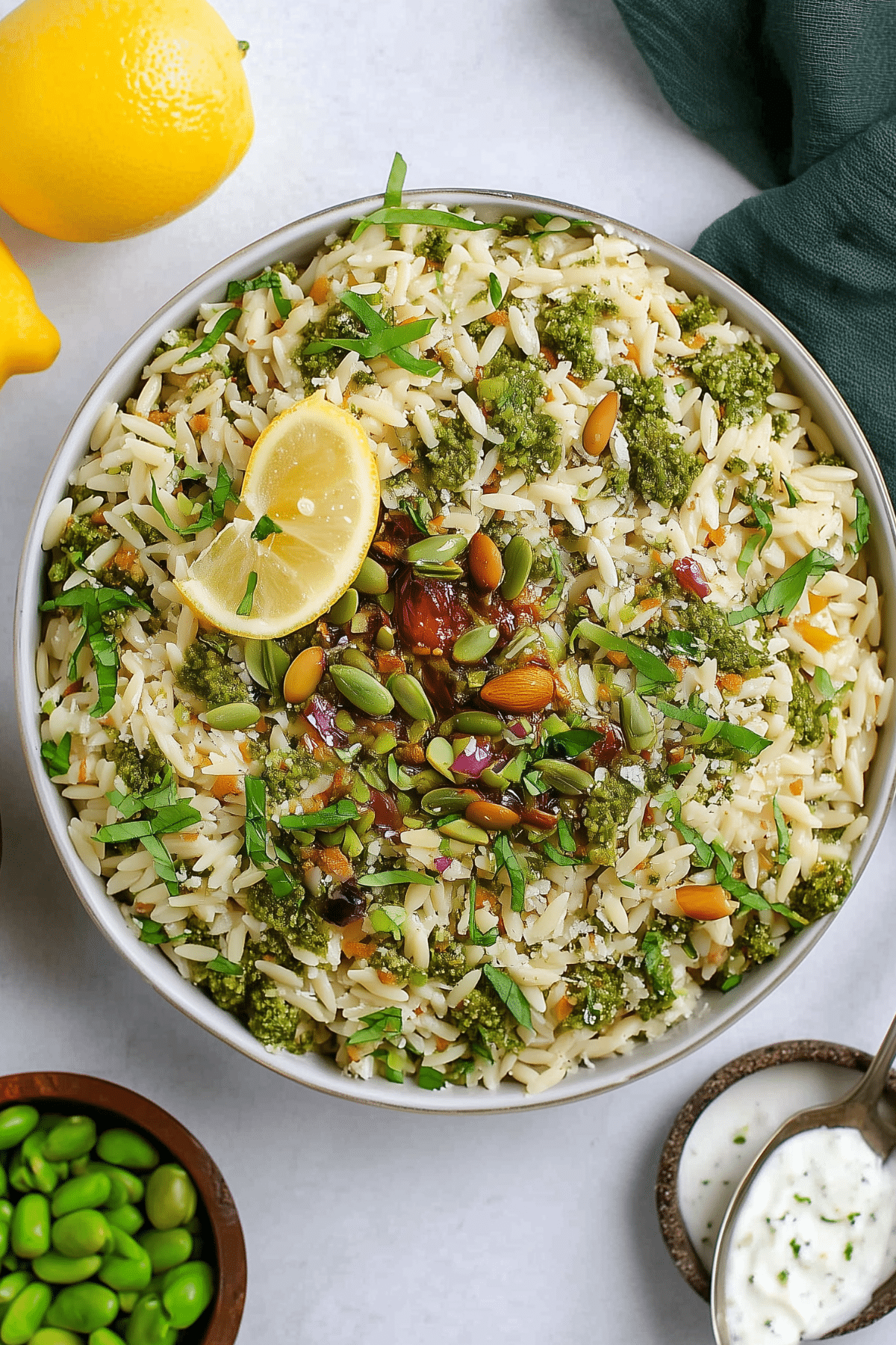 Creamy Pesto Orzo Salad with pesto, peas, ricotta, and pistachios