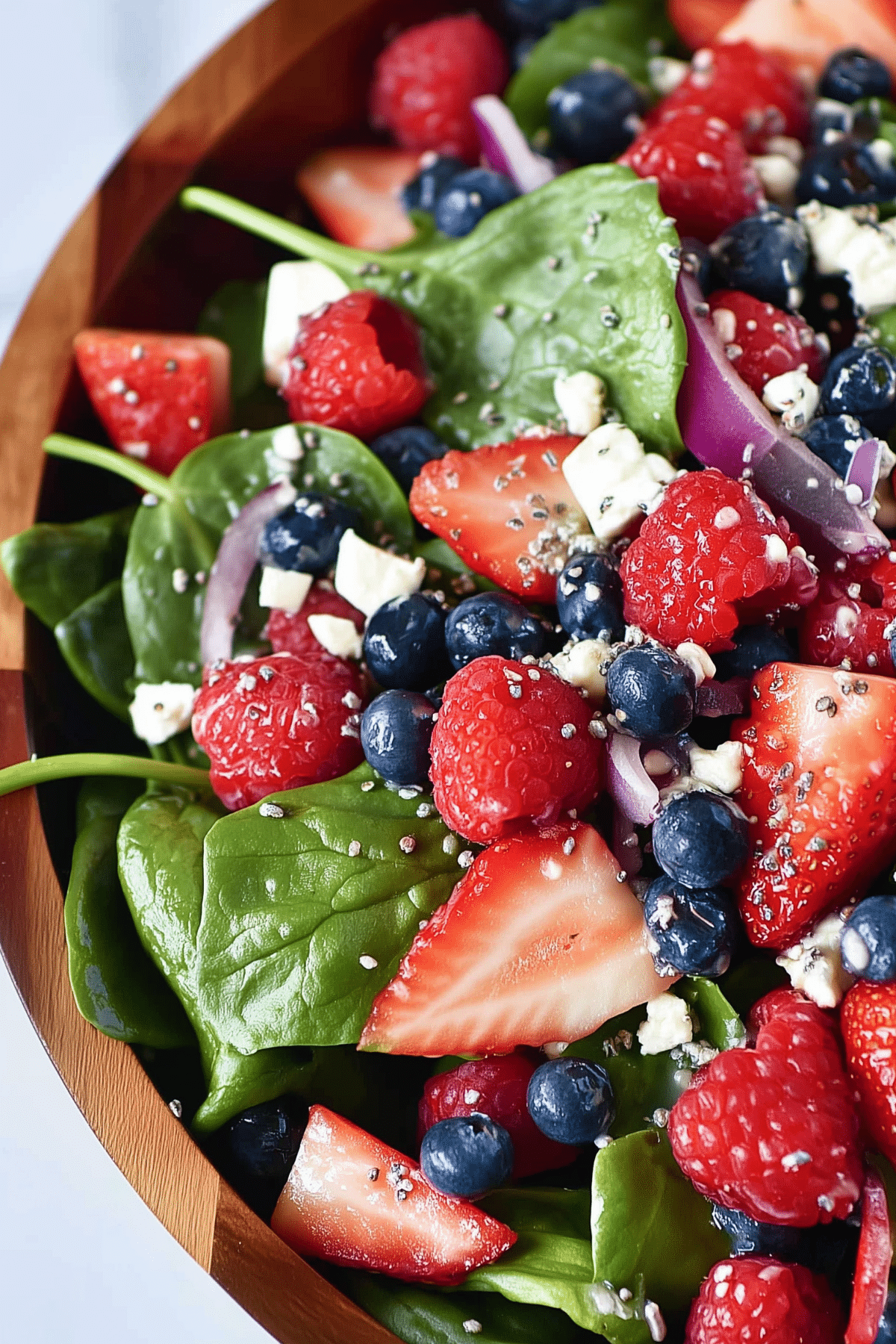 Spinach Berry Salad with Sweet Poppy Seed Dressing served fresh with berries and feta cheese